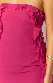 Close-up of the fuchsia strapless mini dress with a ruffled neckline and cascading ruffles down the side