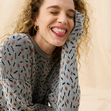 Front image of a woman wearing the Tyler Sweatshirt in Brick and Black