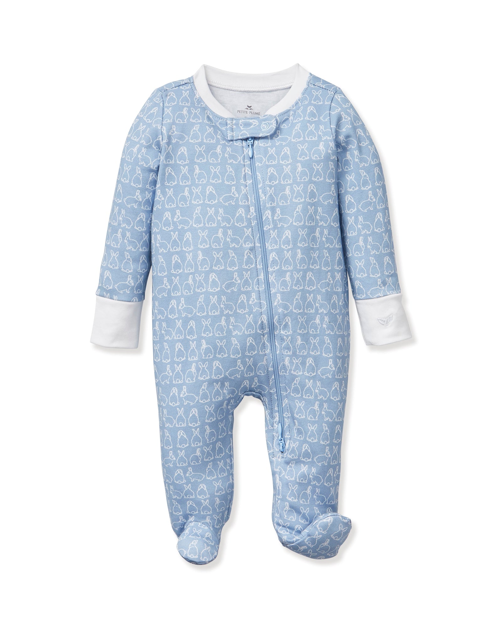 The Baby's Pima Romper in Hoppy Days Blue features a blue footed design with white cuffs, a white collar, white-outlined bunny pattern, and a diagonal zipper from neck to leg.