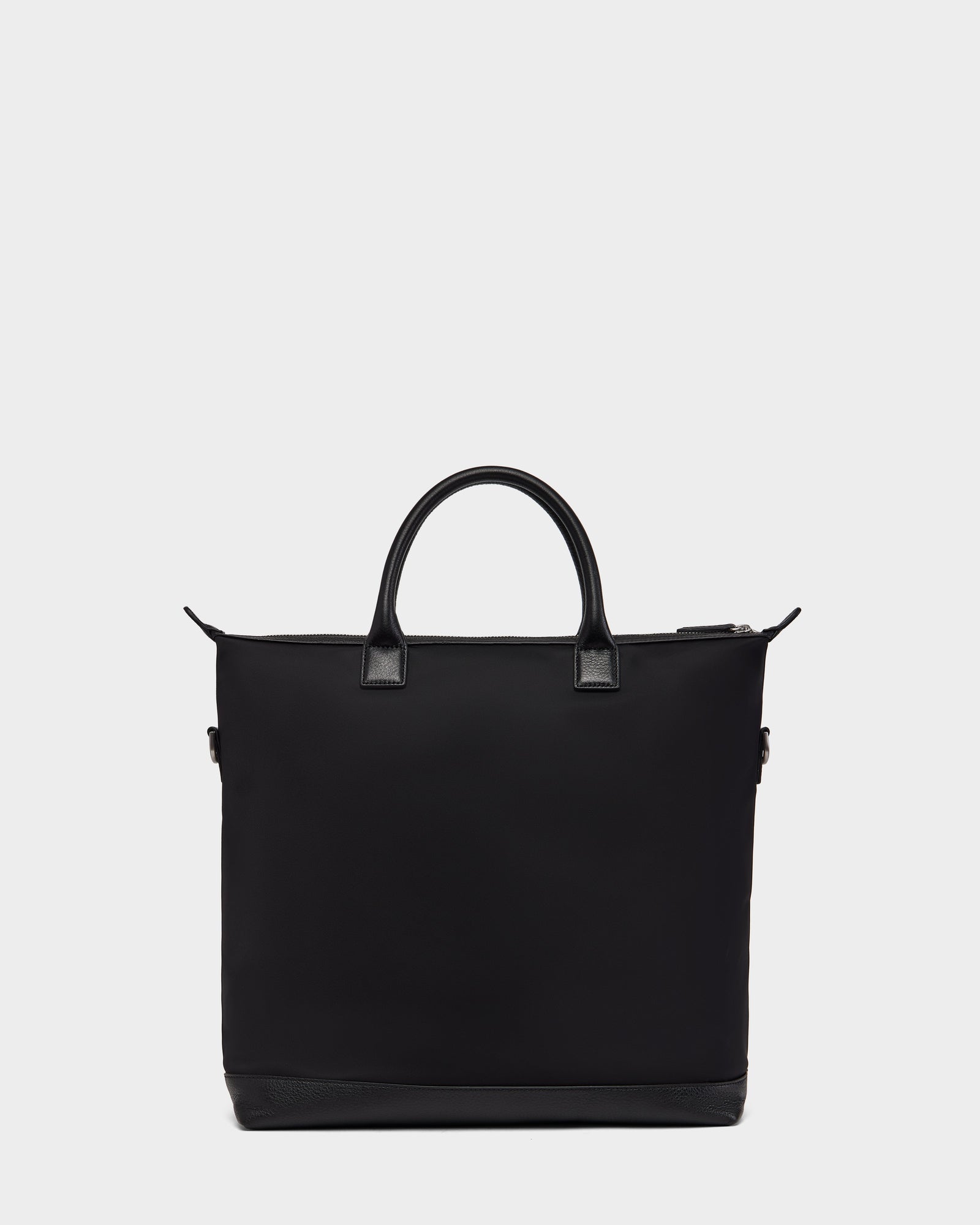 The DEXTER - 9324513 Black by Rudsak is a black canvas tote with two short handles and a zippered top, shown on a white background—a versatile accessory for any outing.