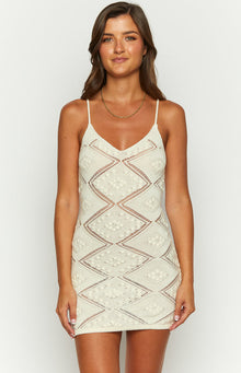 Beginning Boutique Wyoma Cream Knit Mini Dress cream knit mini dress with V-neck spaghetti straps and open-knit diamond pattern