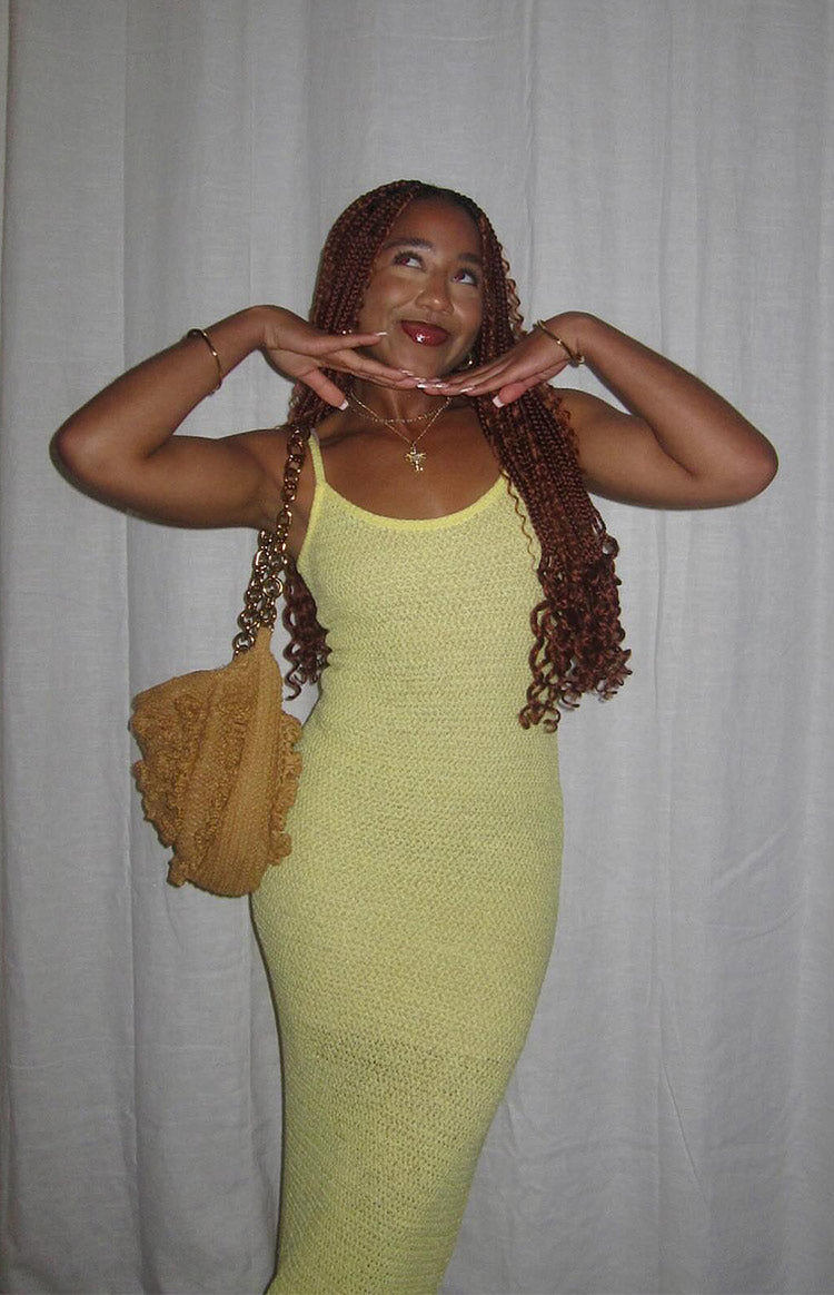 Fitted yellow scoop neck sleeveless maxi dress with a distinct textured knit