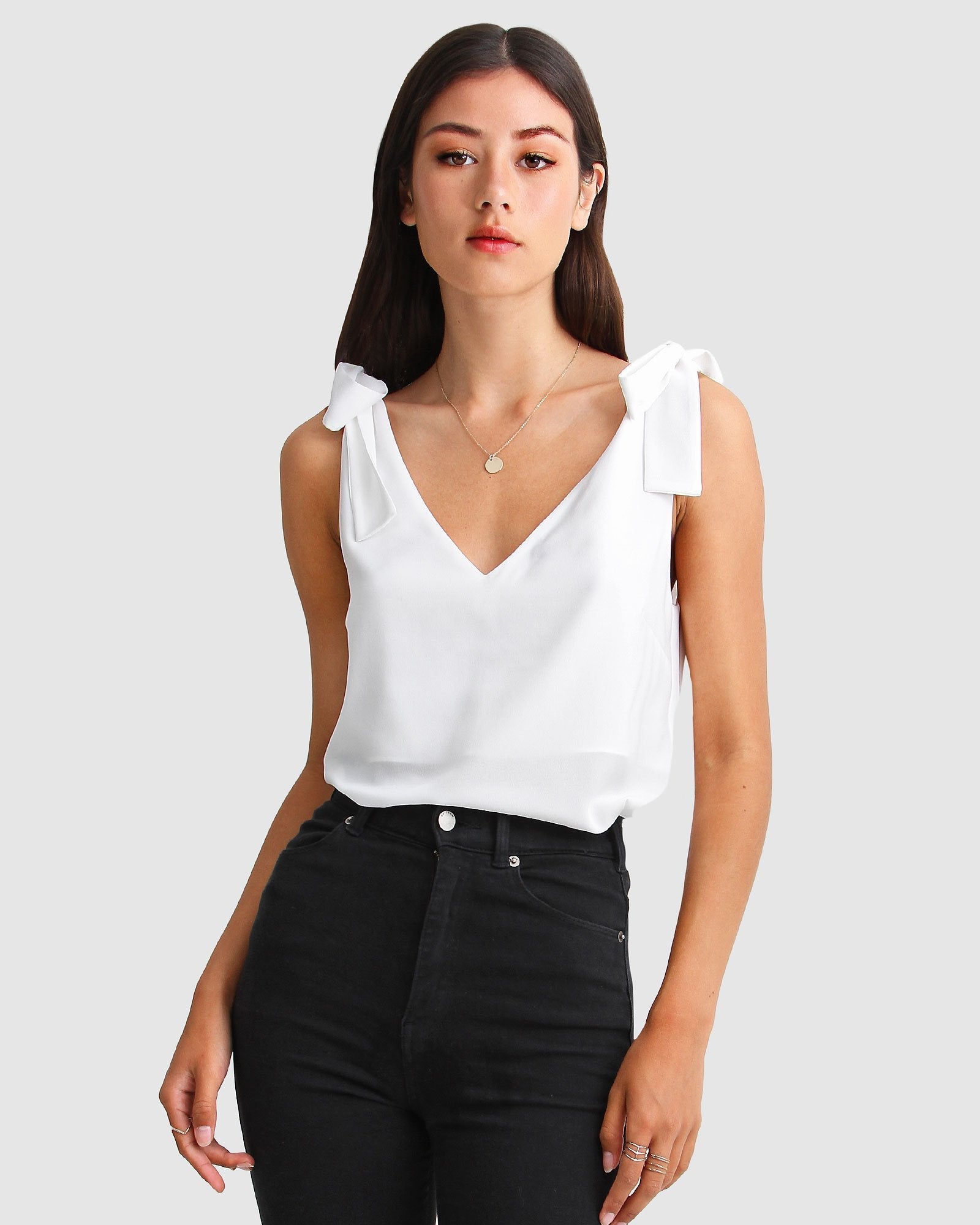 feel-for-you-white-v-neck-top-front_53a7bfc6-8d0c-47a7-9588-4d61fe6e0cb8.jpg
