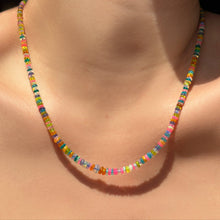 A single strand of Garden Party opals on the neck.