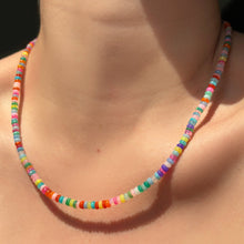 High-biscus opal necklace on the neck.