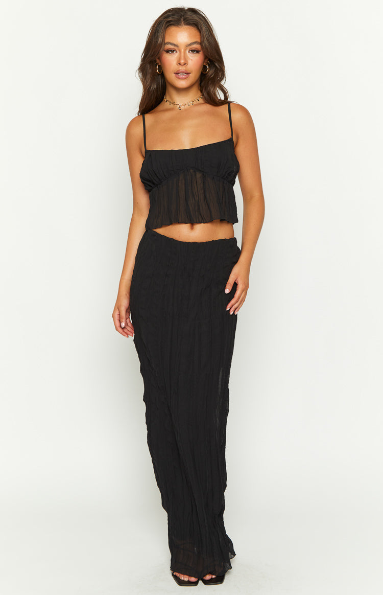 Black crinkled maxi skirt with a fitted silhouette and textured fabric