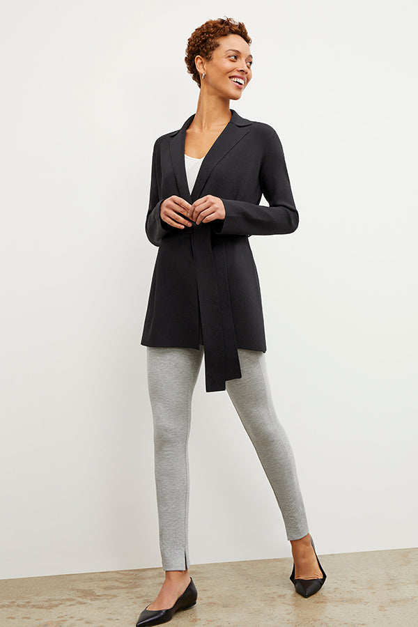 Front image of a woman standing wearing the Stella Legging in Gray Melange | Grid | Exclude